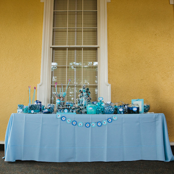 a blue candy buffet bar at the reception