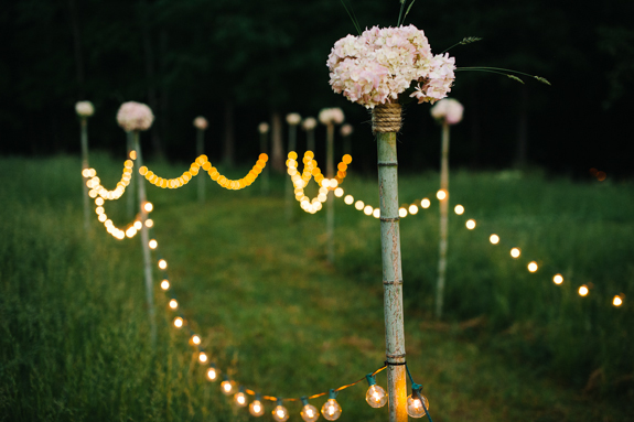 outdoor wedding ceremony lighted aisle
