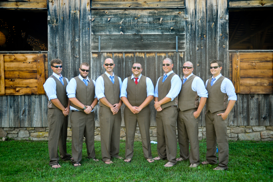 groomsmen in brown pants and vests