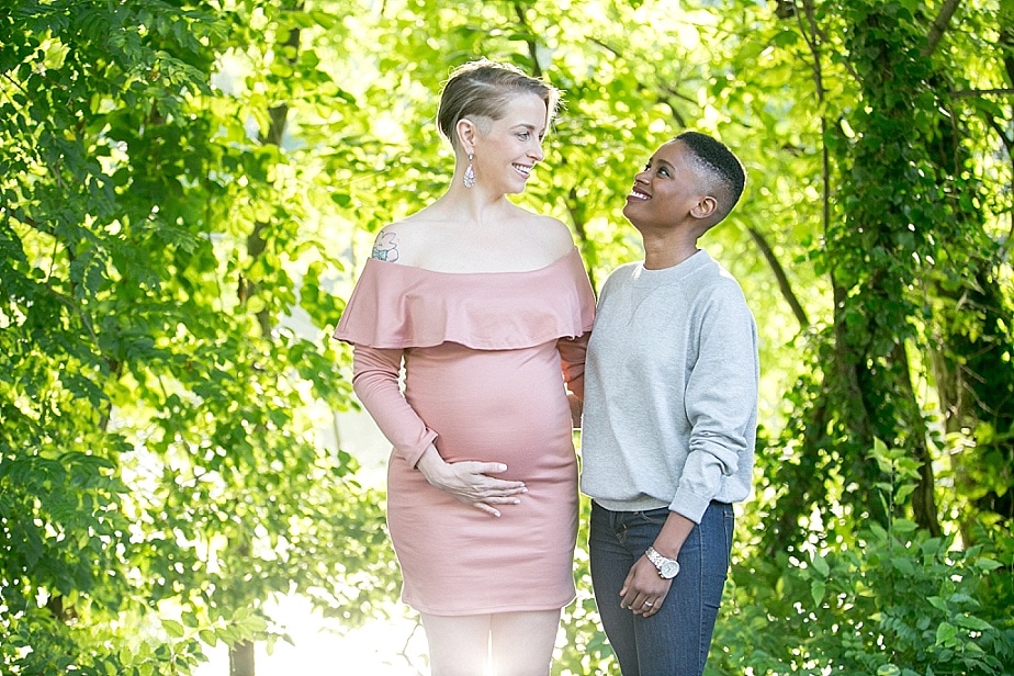 Pregnant Woman Belly In Interracial Love White Caucasian And African Hands Stock Photo